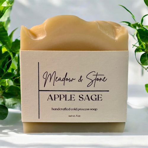Bar of soap with 'Meadow & Stone' label on a light background