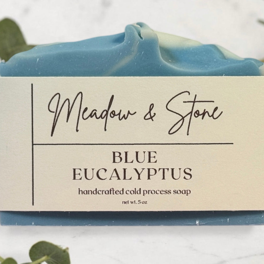 Blue Eucalyptus soap bar with 'Meadow & Stone' label on a light background